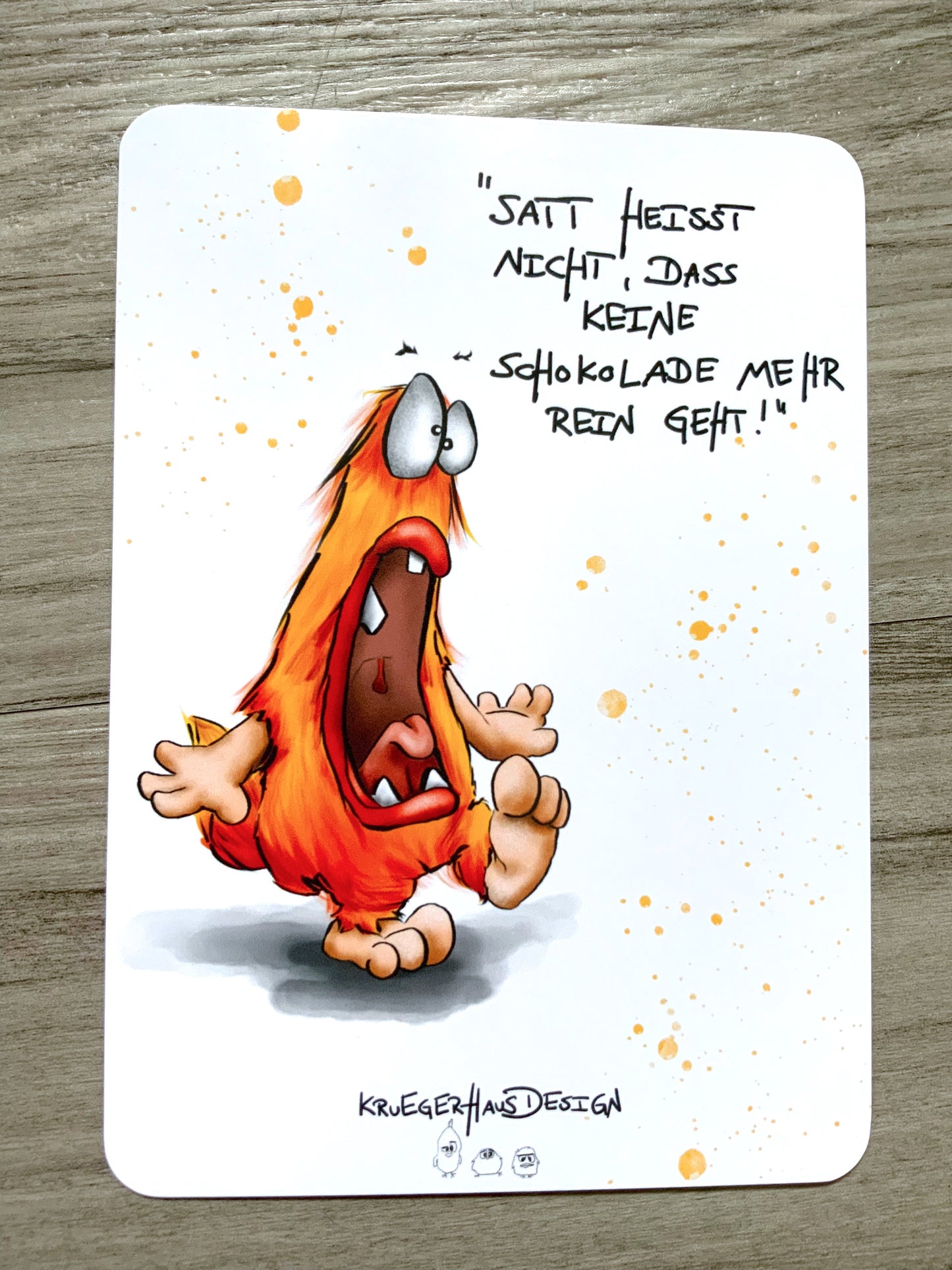 Postkarte Monster Kruegerhausdesign "Satt heisst nicht, dass keine Schokolade mehr rein geht!"